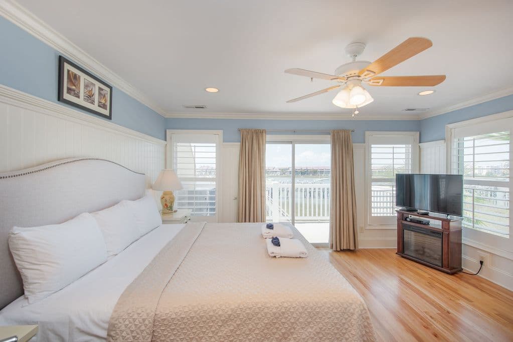Primary suite with deck access and river views